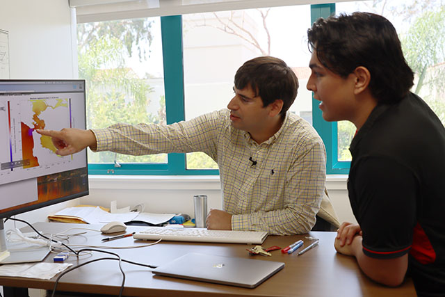 CCEE Faculty member working with a student in his office