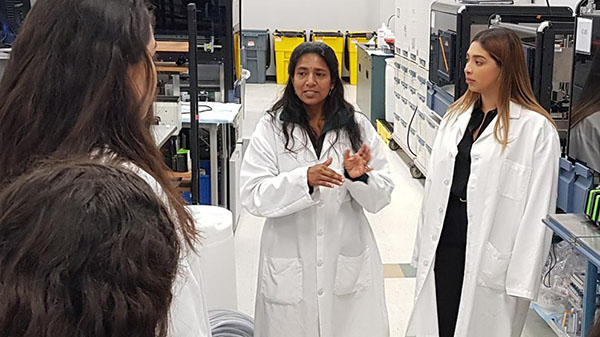 MESA students listen to an engineer during STEM Shadow Day.